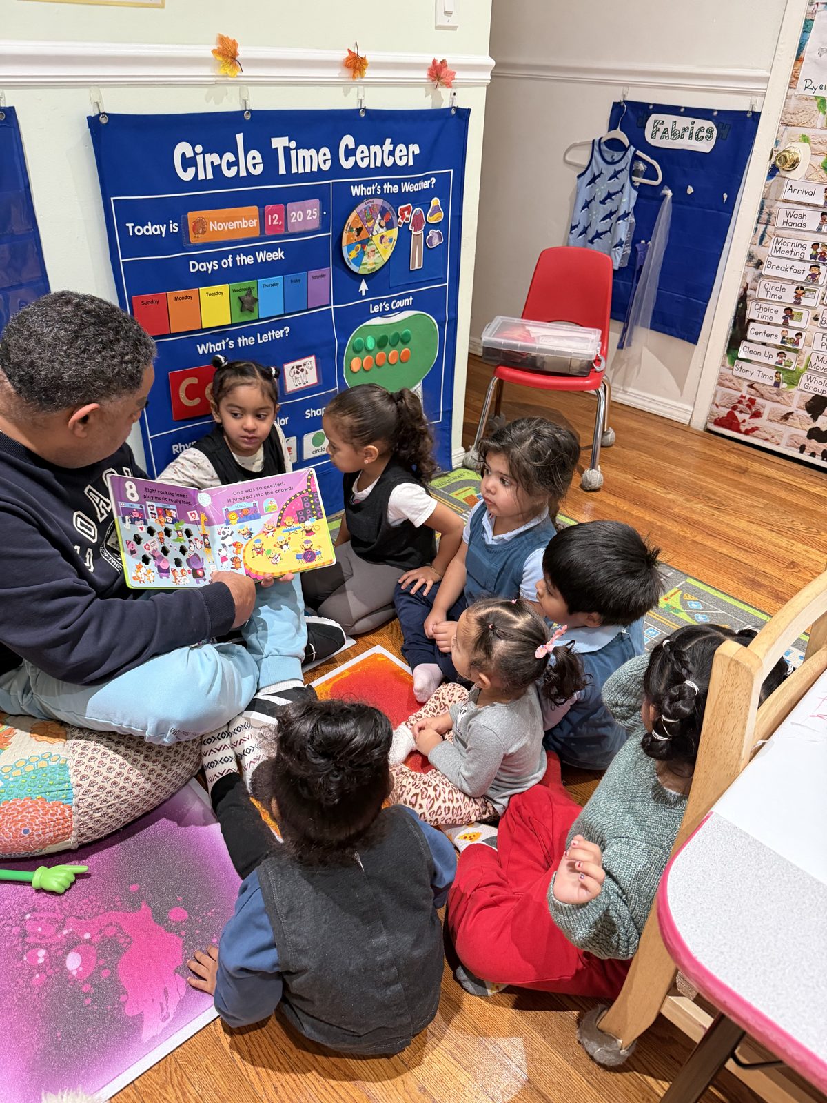 Circle time story reading at Lucy Rainbow Daycare
