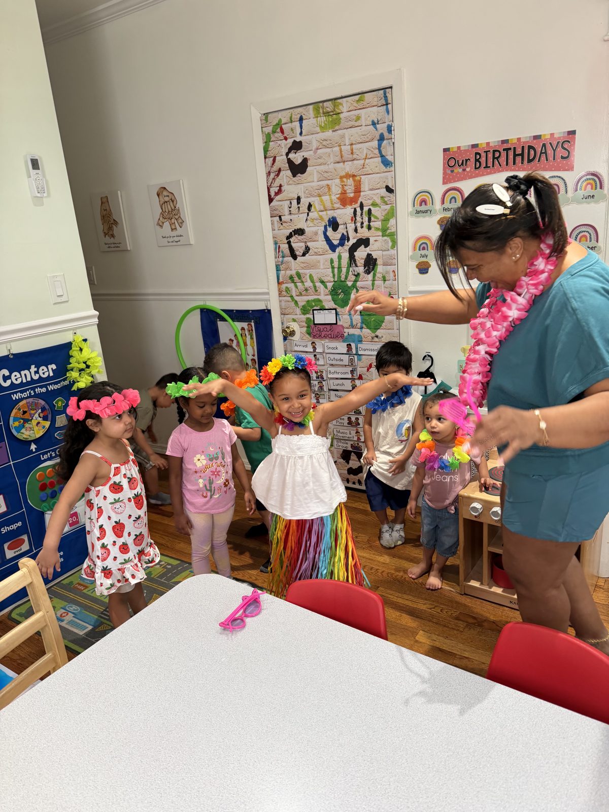 Children celebrating with leis and flower crowns